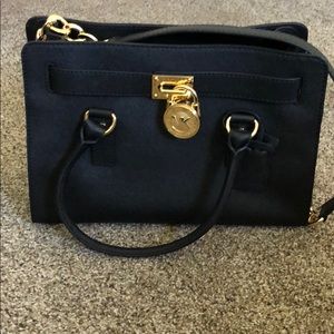 Michael Kors black and gold purse